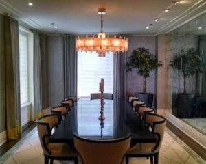 chandelier installed over a dining room table