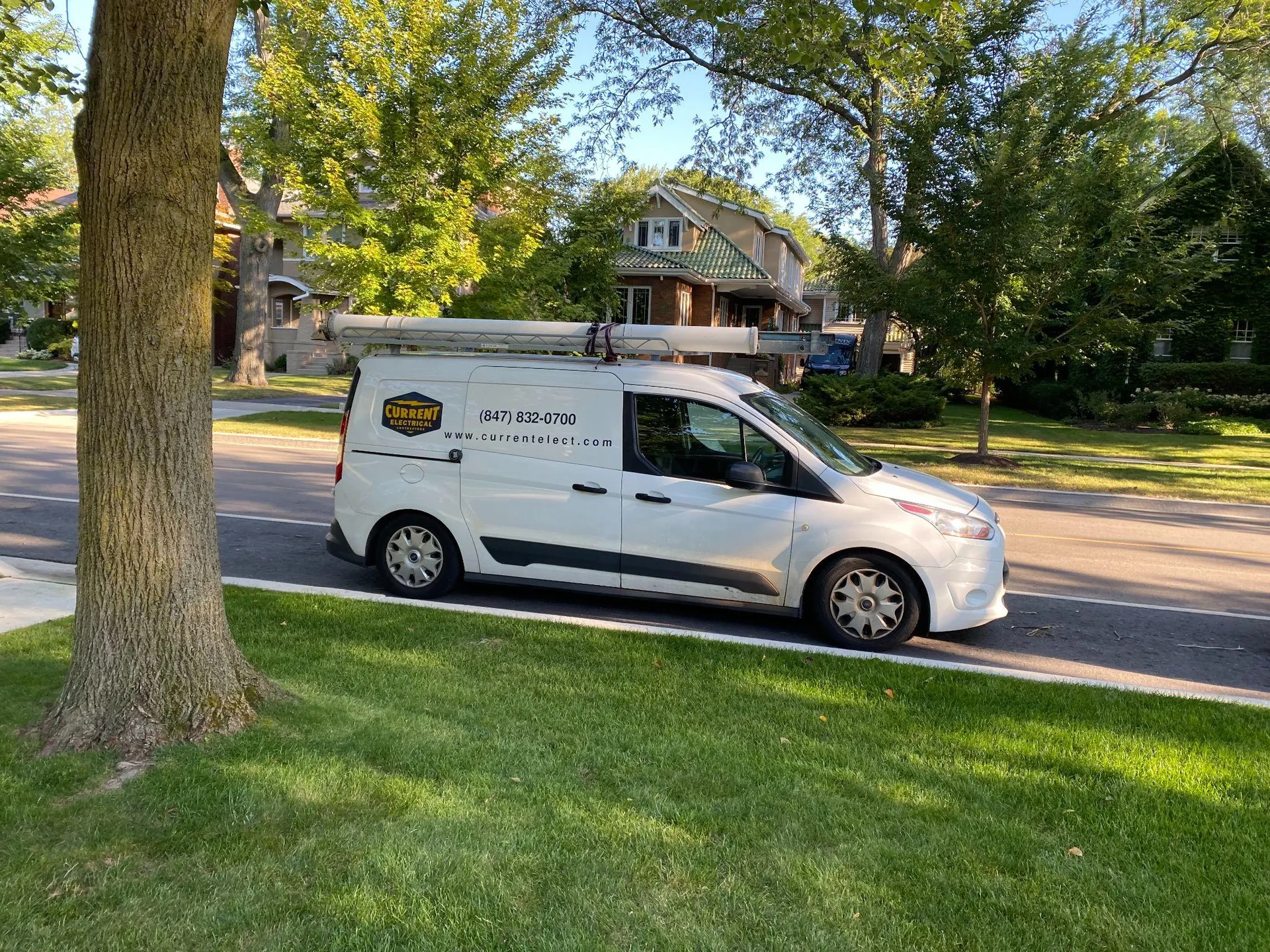 Current Electrical Contracts vehicle parked outside of a Buffalo Grove home.